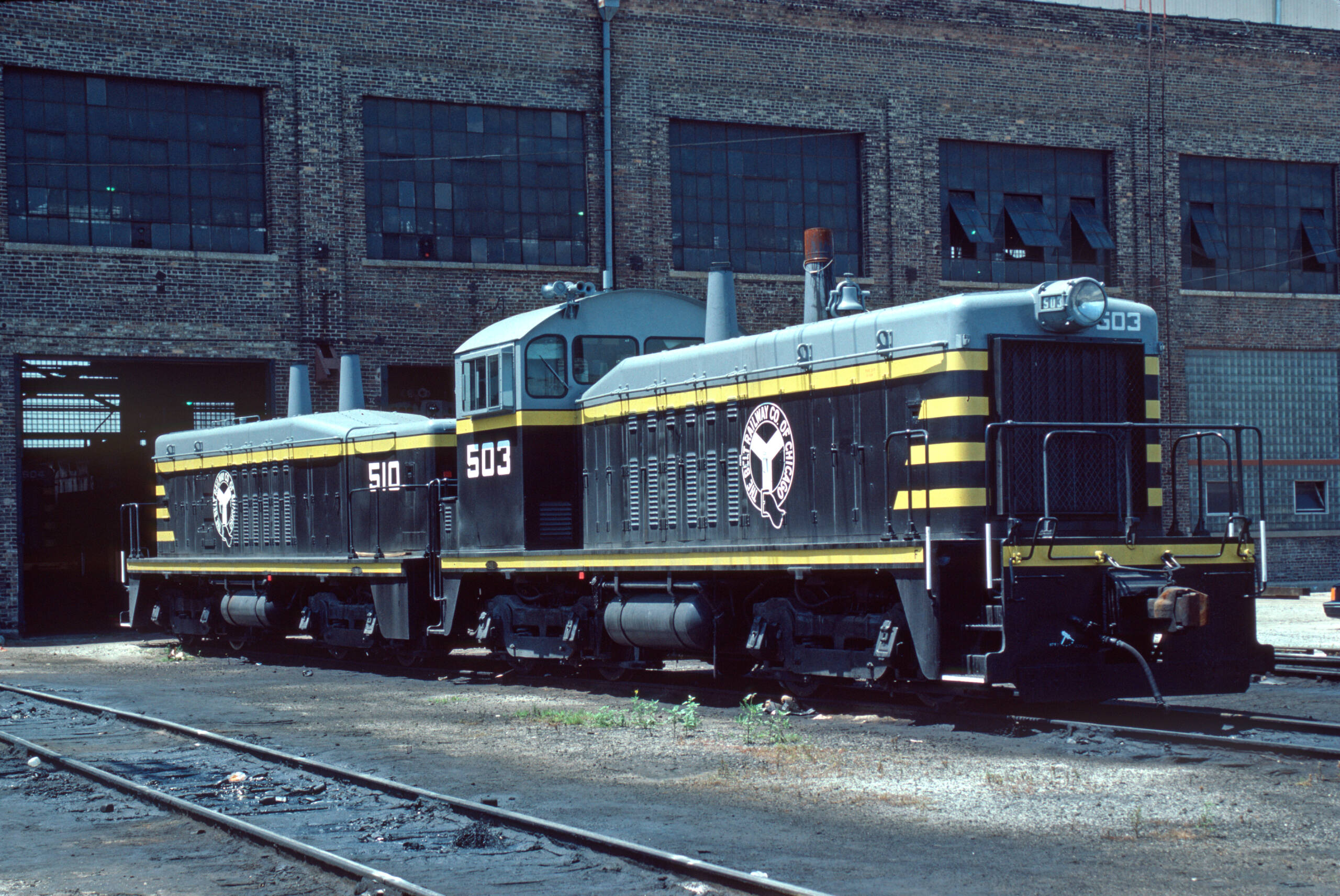 black and silver with yellow stripes on locomotive