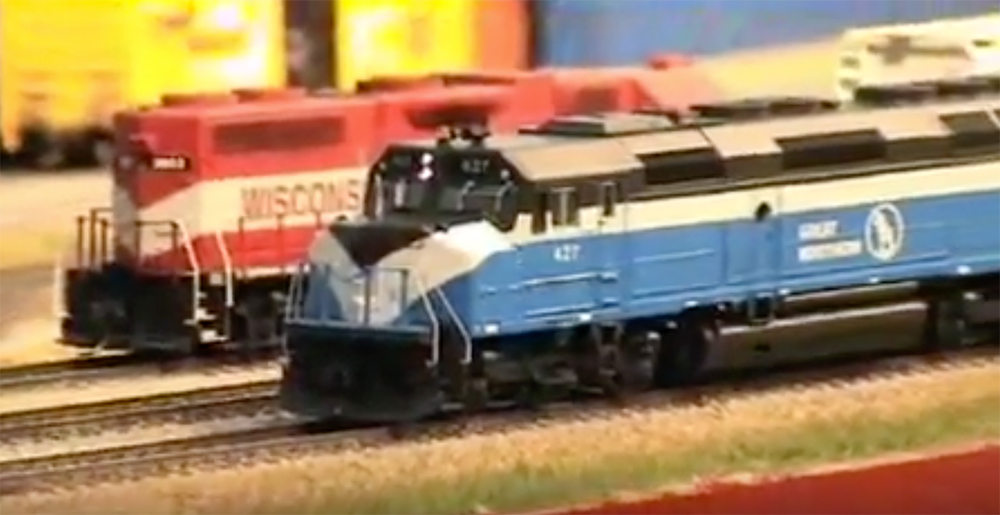 A model train on the tracks.
