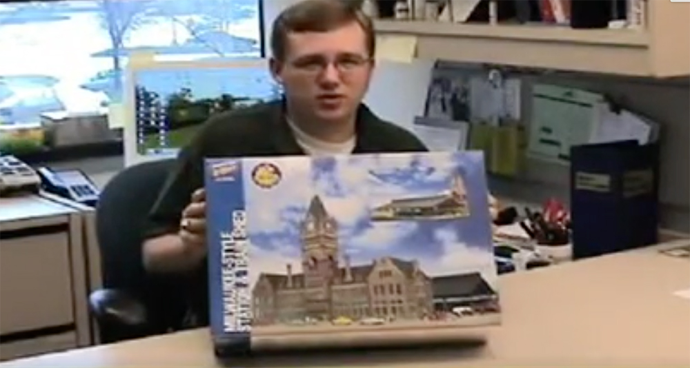 Cody Grivno holding a model box.