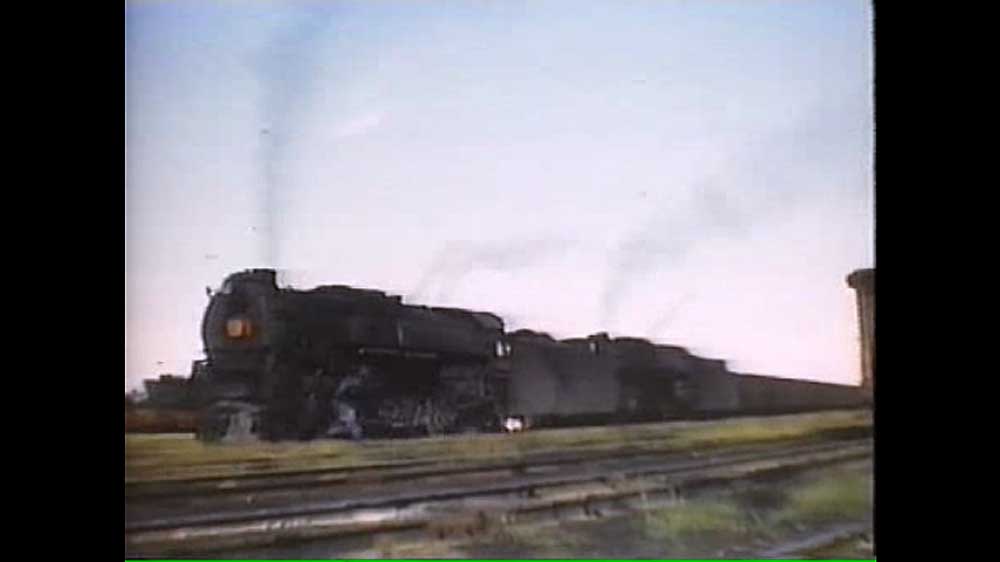 Two steam locomotives on freight train
