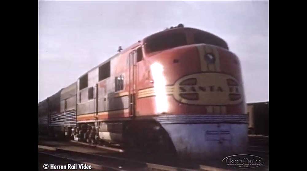 Red diesel locomotive on passenger train