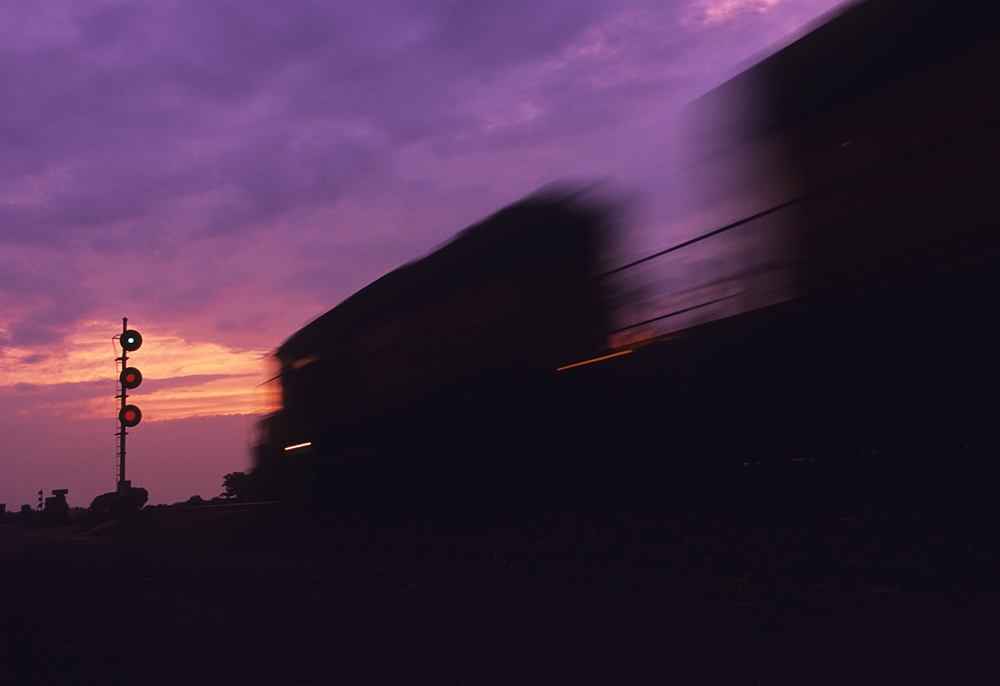 purple sky with train moving fast