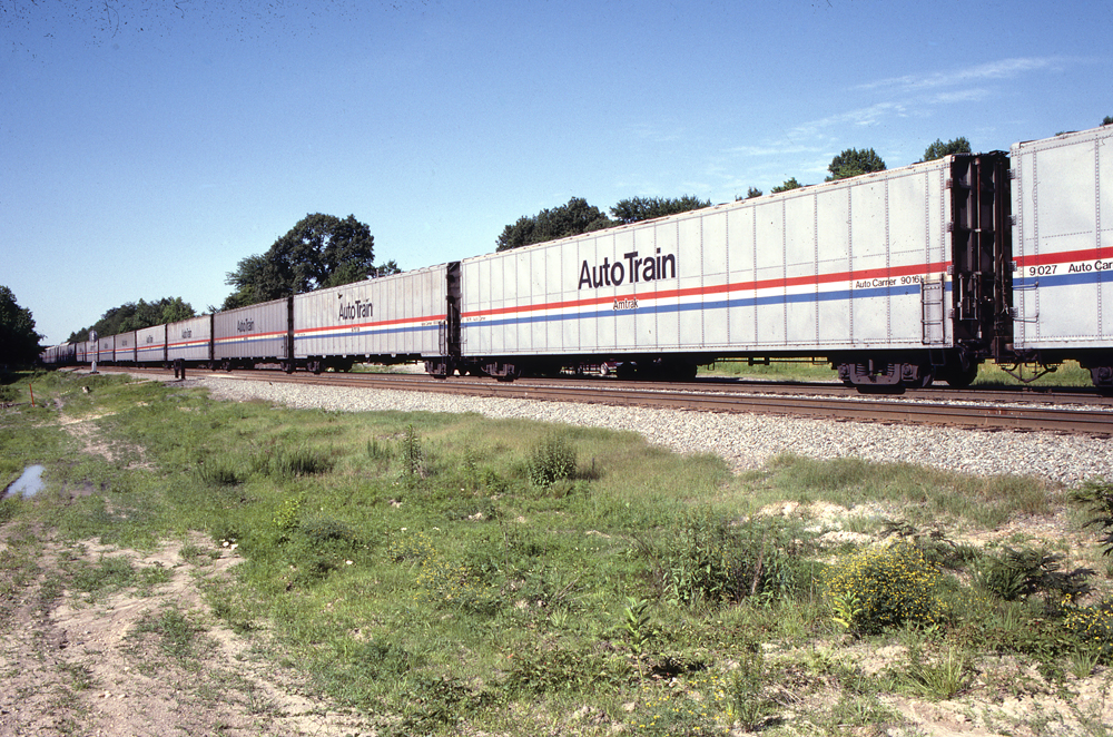 side view of white Auto Train