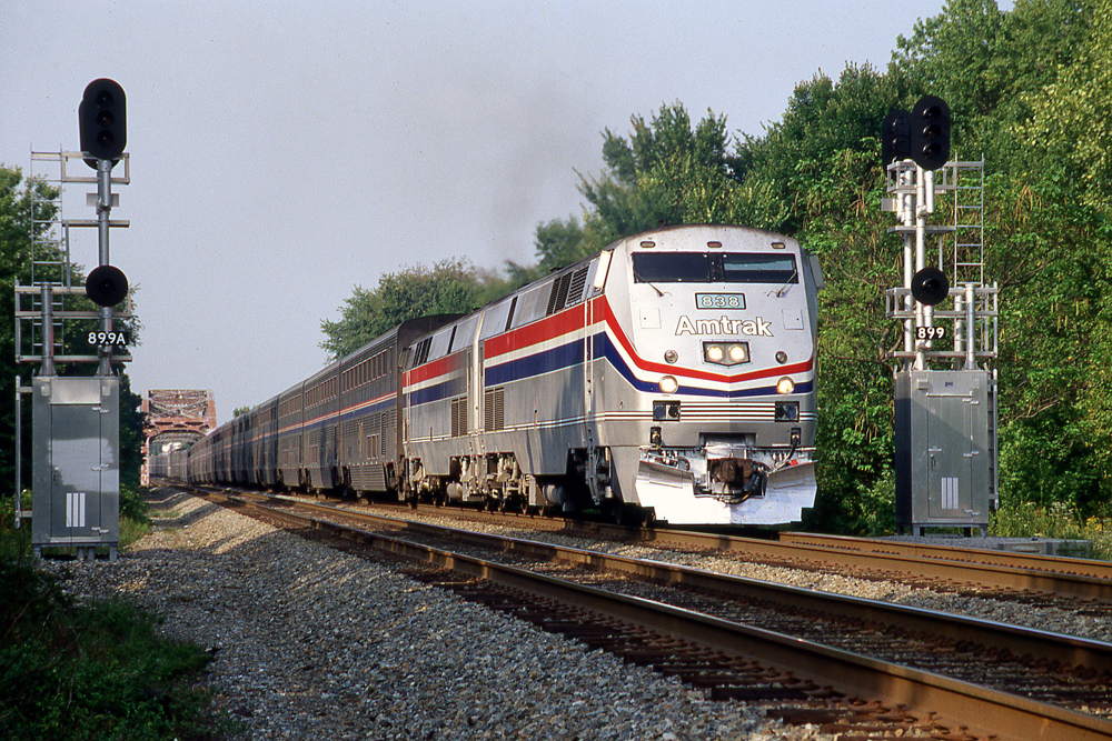 close up of silver Auto Train on tracks