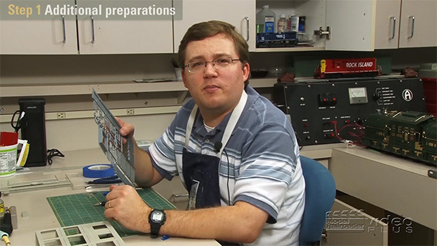 Cody Grivno holding a structure kit.