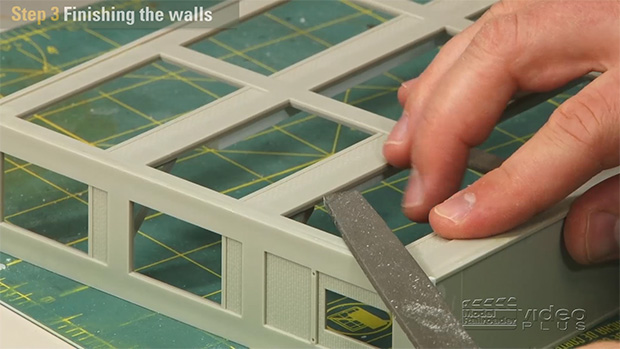 Cody Grivno building a low-relief structure kit.