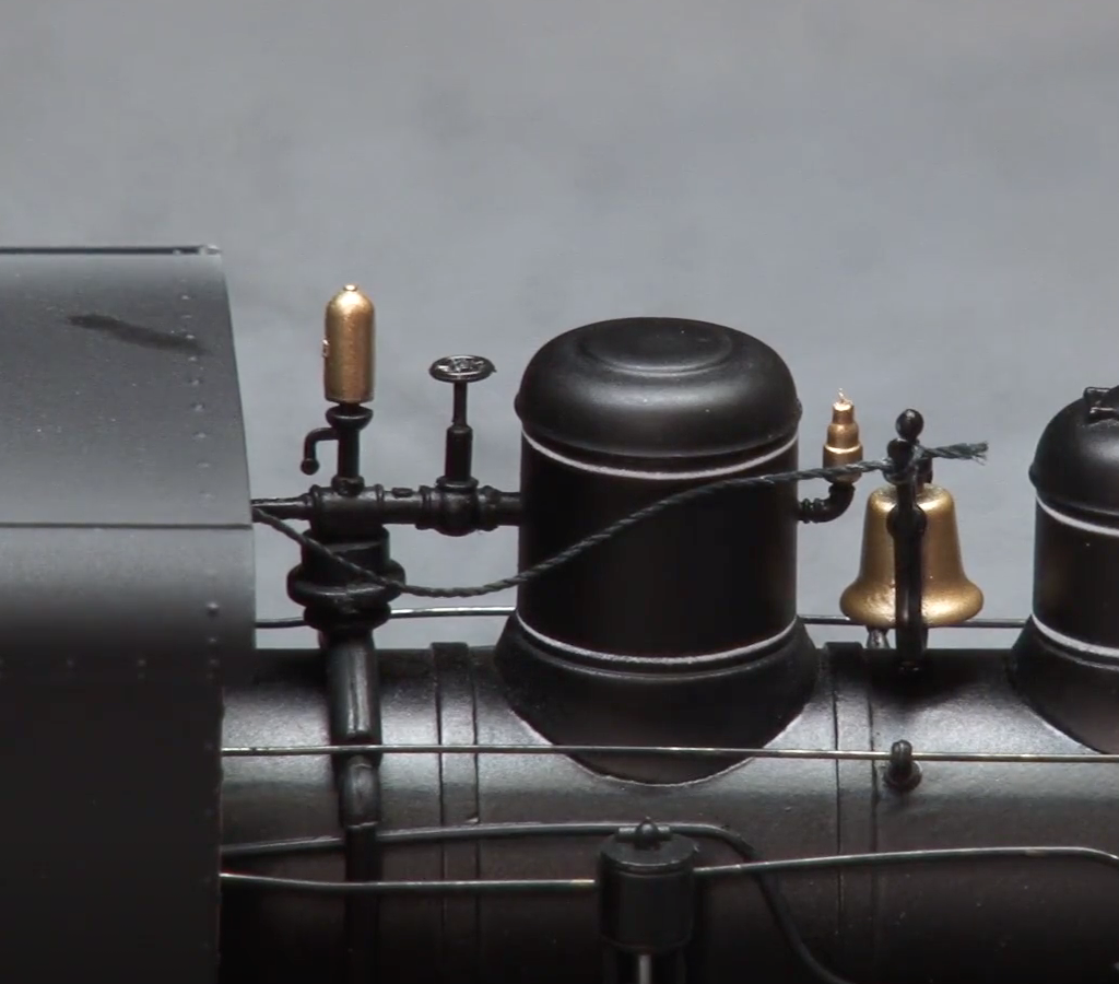 Close view of a steam locomotive's top side.