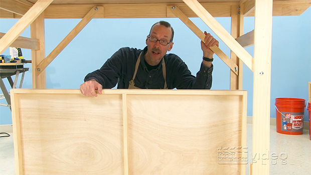 David Popp under a workbench.
