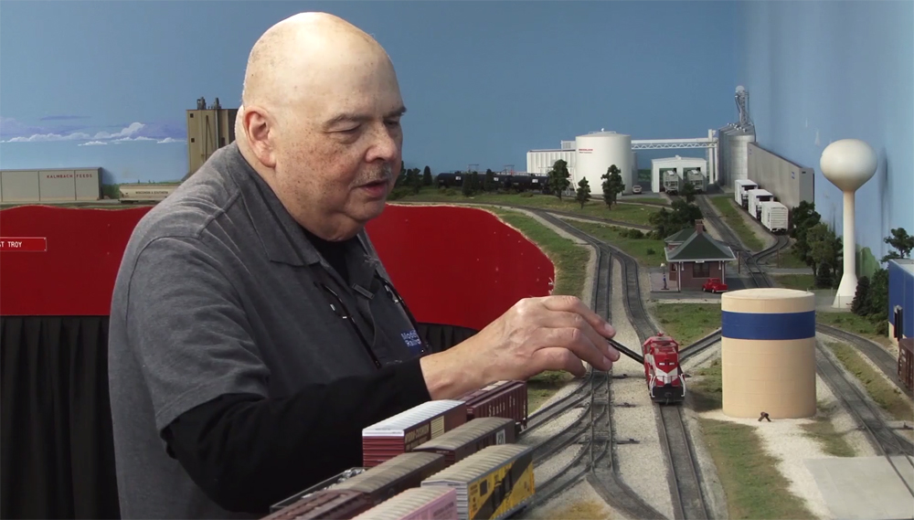 Andy Sperandeo standing at the MR&T HO scale model railroad layout