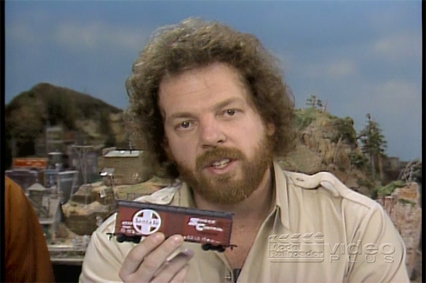 Malcolm Furlow holding a train car