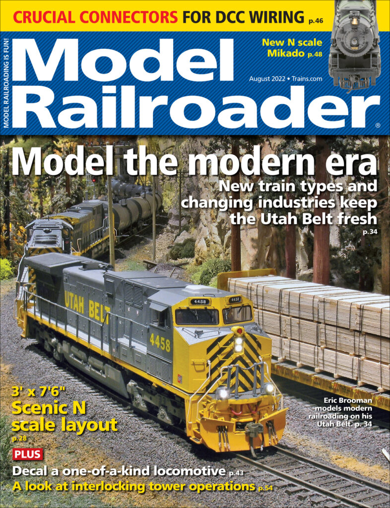 yellow and gray train coming towards viewer