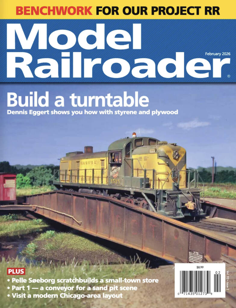 The February 2026 cover of Model Railroader, which features a yellow diesel locomotive model on a model railroad layout