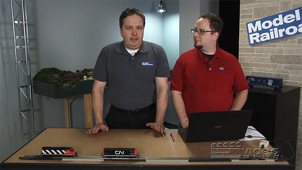 Dana Kawala and Ben Lake standing at a desk.