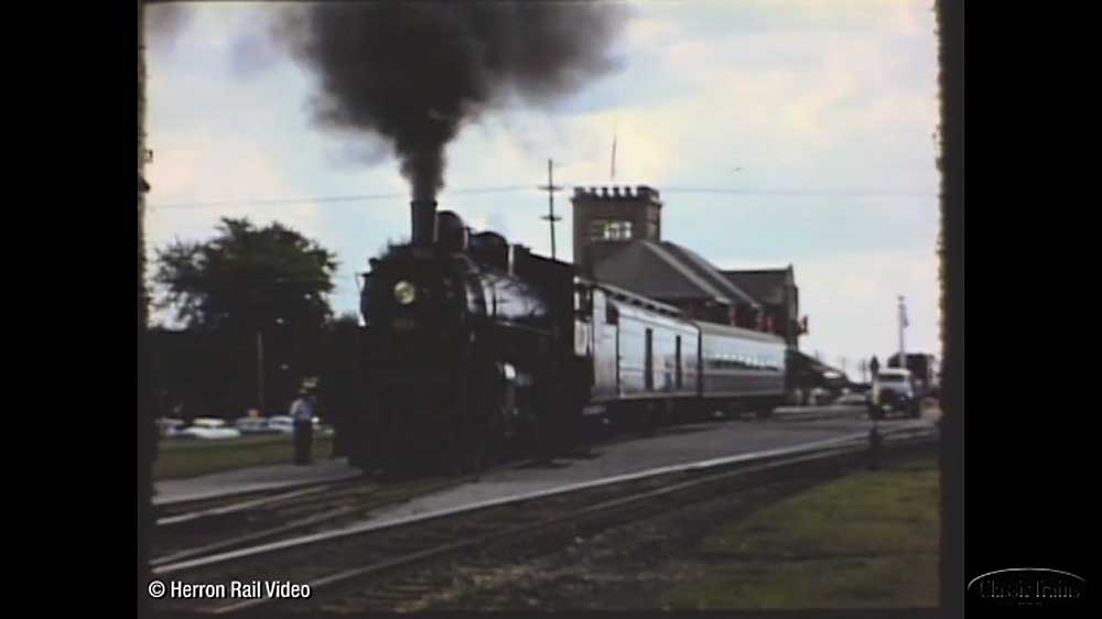 Steam locomotive under dark smoke