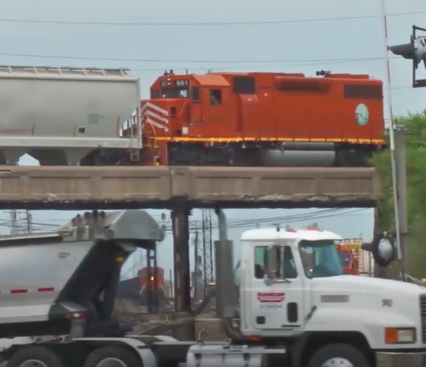 Several trains and a truck in a complicated visual display.