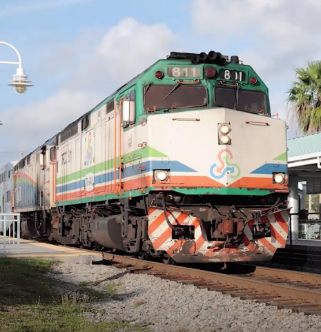 Brightly painted diesel electric locomotive.