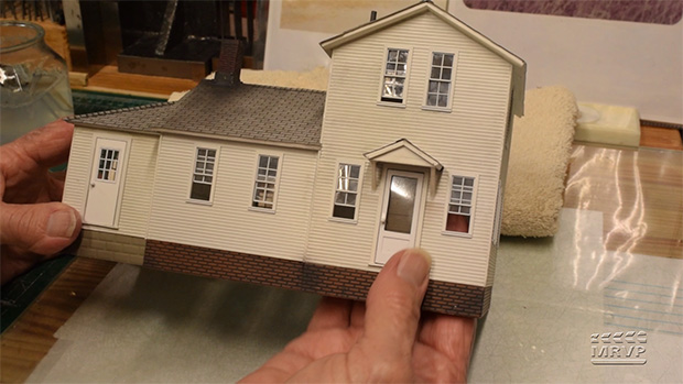 Hands holding model structure