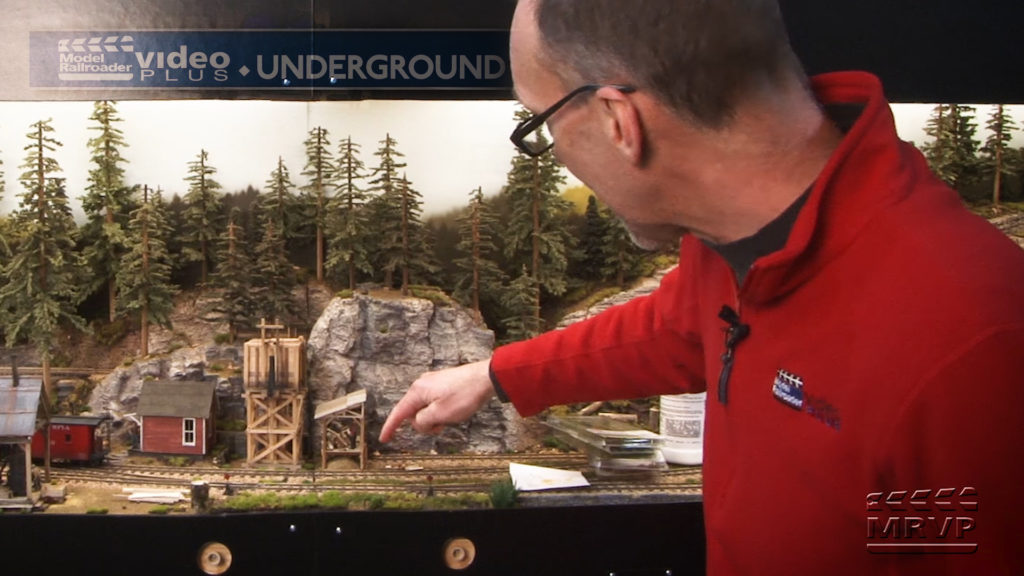 David Popp next to trees on layout