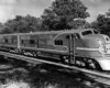 A closeup of a santa fe train sitting on the tracks