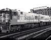 A santa fe train passing by a chicago cold storage building