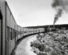 Passenger train bends around curve as seen from onboard