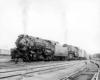 Smoking steam Missouri Pacific locomotives with freight train