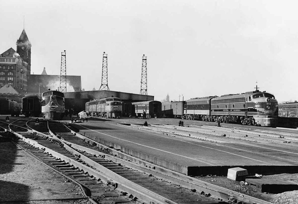 Passenger trains lined up outside of passenger station