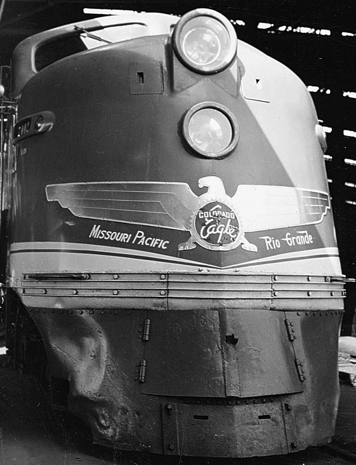 Streamlined diesel locomotive with metal emblem attached to nose