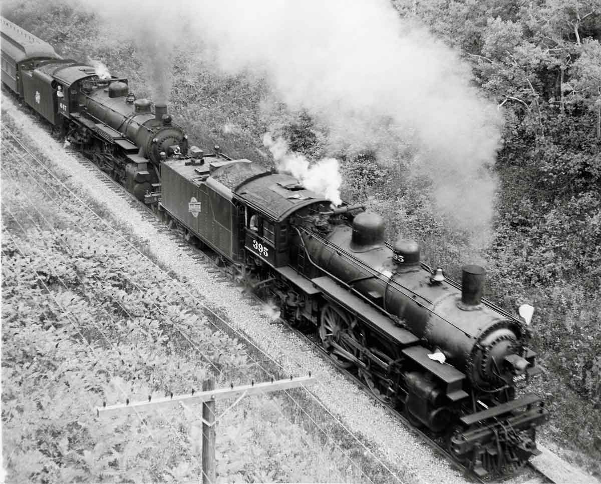 Steam Chicago & North Western locomotives with passenger train