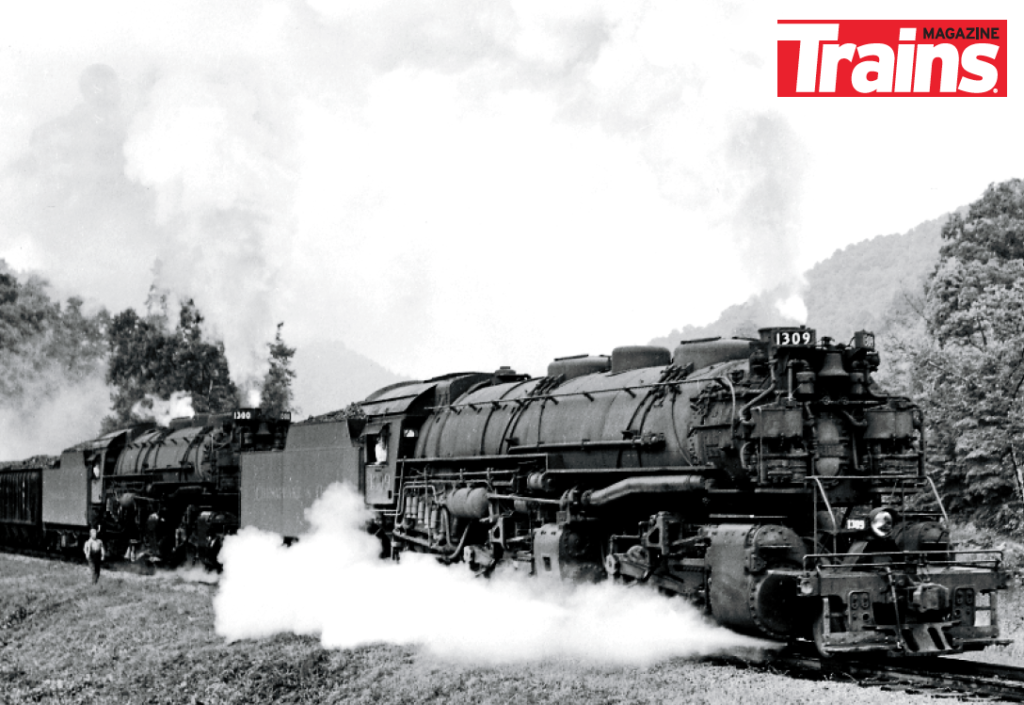 A 2-6-6-2 Mallet style steam locomotive ascends a grade in the Eastern United States.
