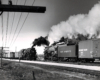 A black and white photo of two N-2 2-8-4 locomotives coming head to head on the tracks