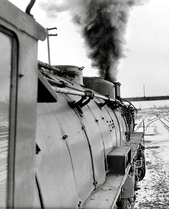 A picture taken out of the window of a train, looking forward