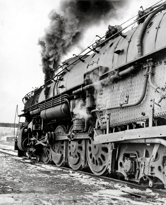A close up shot of the wheels on a train
