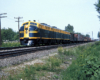 A yellow and navy blue FT diesel locomotive on the tracks