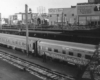 Passenger train in station under bridge