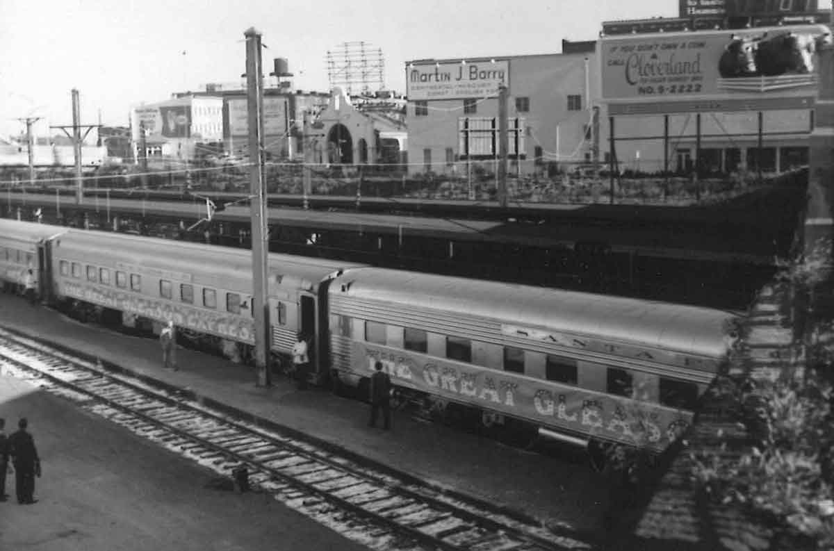 Passenger train in station under bridge