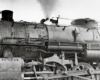 A closeup shot of the wheels on a train