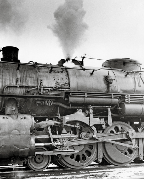 A closeup shot of the wheels on a train