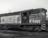 A texas and pacific train sitting on the tracks