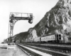 Rear of passenger train by signal cantilever