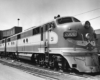 A closeup shot of a train sitting on the tracks