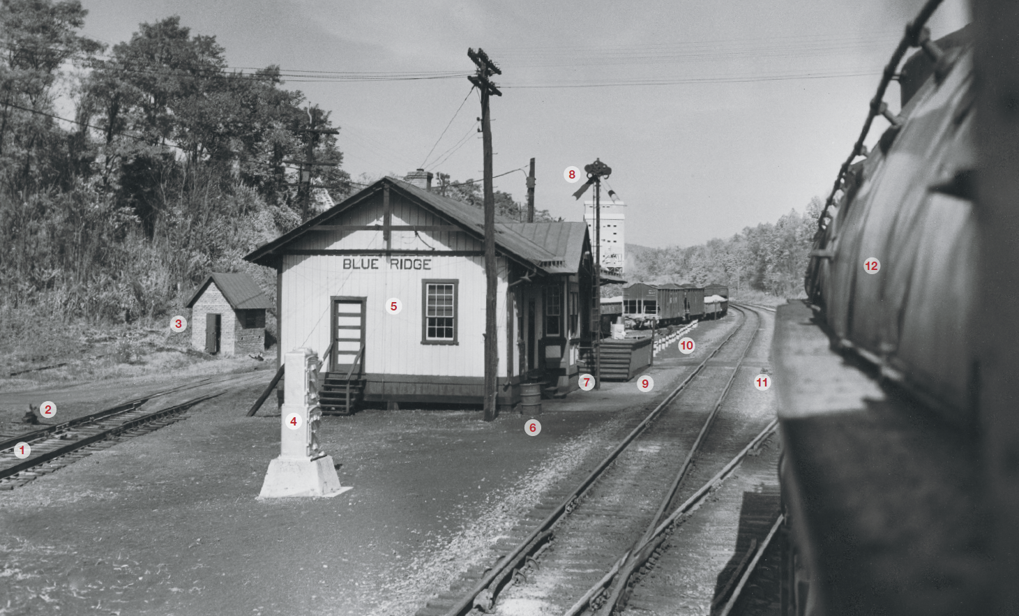 View from the cab of a Norfolk & Western 2-6-6-4 steam locomotive on an eastbound freight in 1953 at Blue Ridge, West Virginia. The photograph is black and white with 12 numbered callouts.