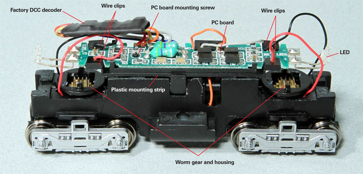 How to add DCC sound to a compact HO switcher: an image of the inside of a model locomotive
