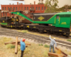 An close up view of a green and black wrecker and work caboose.