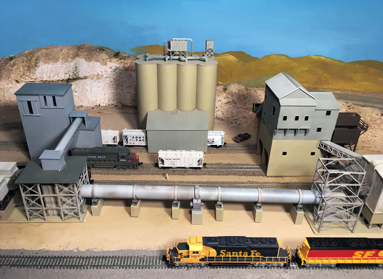 See what you're really modeling: A model railroad layout with a cement mixing facility and a train in the foreground
