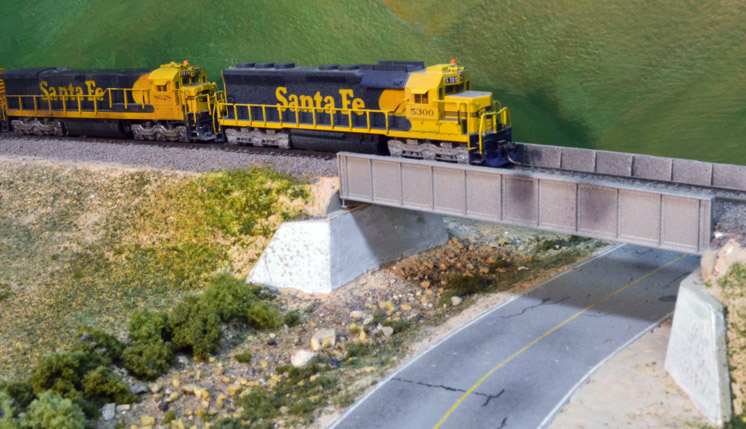 Modeling plate girder bridges: An image of an A/B set of model locomotives crossing a bridge