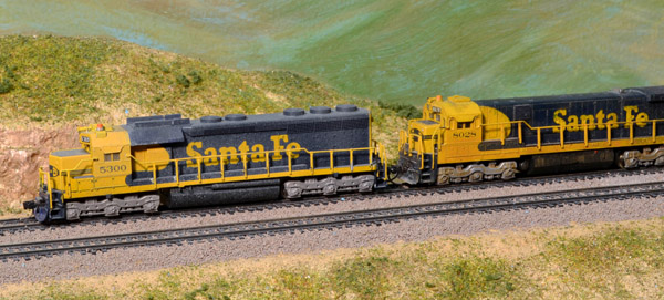 N scale layout design tips and considerations: Two santa fe model locomotives on a model railroad layout