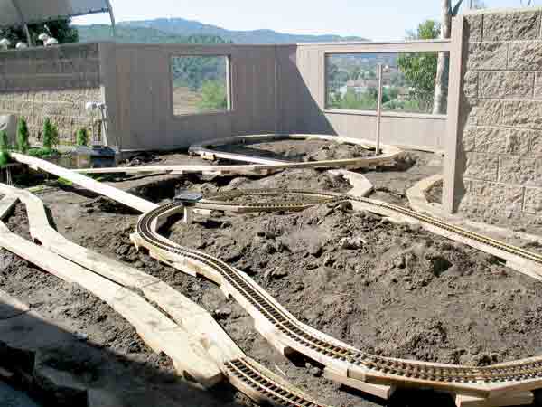 unfinished garden railroad showing path of track