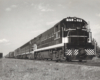 A black and white close up photo of a diesel locomotive