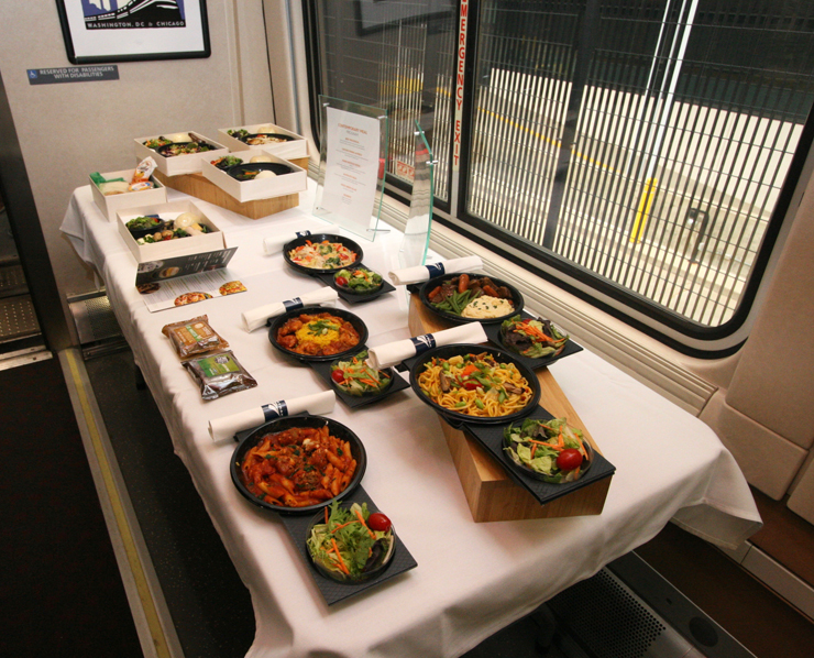 Samples of Amtrak food on table in dining car